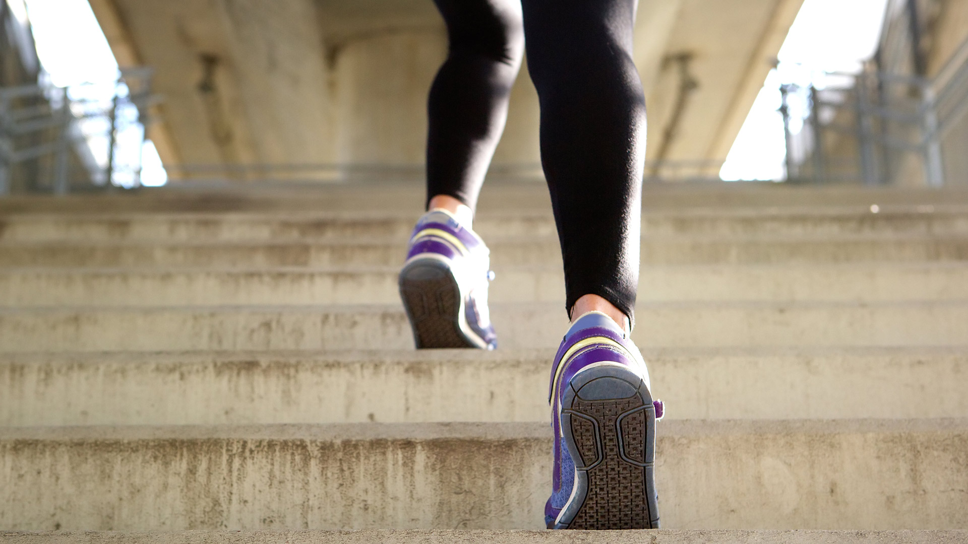 woman running up stapes